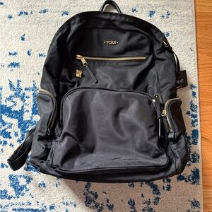Tumi Black and Gold Women’s Backpack